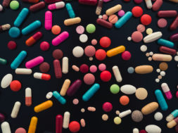 colorful pills on black background