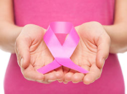 Woman with breast cancer awareness ribbon