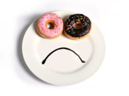 smiley sad face on dish with donuts eyes chocolate mouth