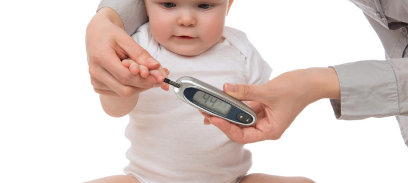 measuring glucose level blood chemistry test from diabetes child