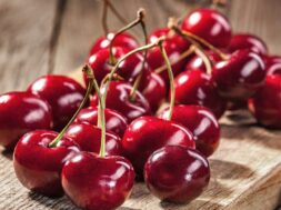 Ripe red cherries on old boards