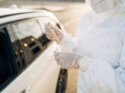 doctor-doing-pcr-test-covid-19-patient-through-car-window_147764-744