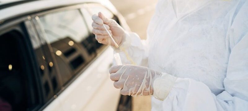 doctor-doing-pcr-test-covid-19-patient-through-car-window_147764-744
