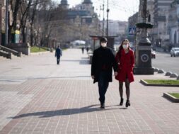 people-facial-protective-masks-almost-empty-street_1153-5033