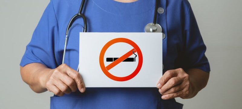 quit-smoking-no-tobacco-day-doctor-holding-no-smoking-sign_61573-2750