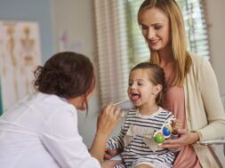 Routine examination of little girl’s throat