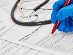 doctor-blue-medical-gloves-is-getting-ready-fill-out-virus-test-requisition-form-stethoscope-background-closeup_98862-479