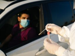 doctor-doing-pcr-test-covid-19-patient-through-car-window_147764-738