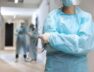 front-view-doctor-wearing-protective-wear-hospital_23-2148722316
