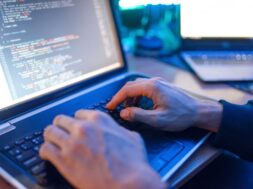 hacker-sitting-laptop-information-hacking_266732-1044