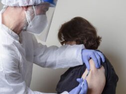 senior-woman-getting-vaccination_109656-886