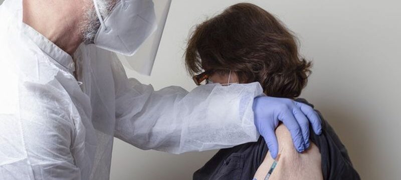 senior-woman-getting-vaccination_109656-886