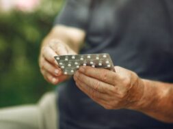 taking-pills-close-up-white-pills-man-s-hands_1157-40965