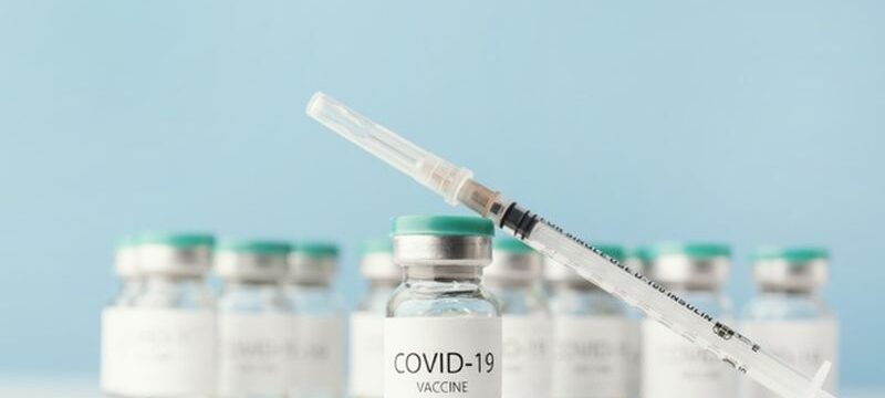 arrangement-with-coronavirus-vaccine-bottle_23-2148920163