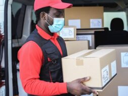 black-delivery-man-wearing-safety-mask-coronavirus-prevention-focus-face_166273-1011