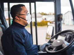 busdriver-with-protection-mask-gloves-driving-intercity-bus_221589-2