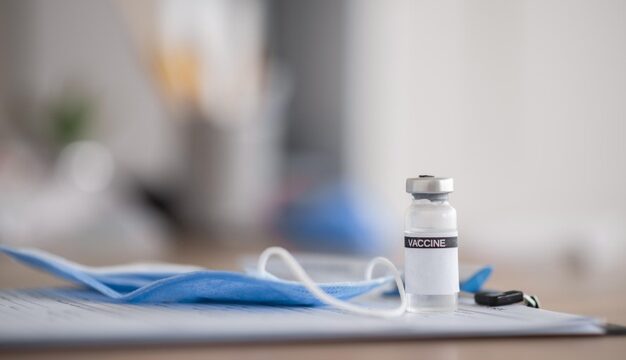 composition-vaccination-elements-with-medical-mask_23-2148880472