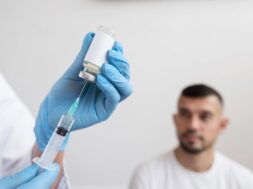 doctor-getting-ready-vaccine-patient_23-2148803368