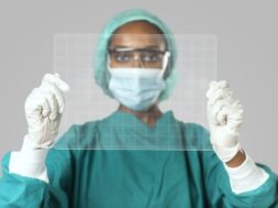 doctor-holding-futuristic-transparent-tablet-screen_53876-97064