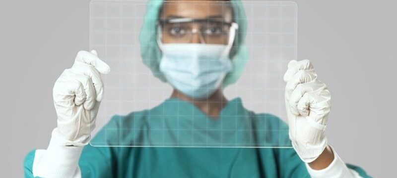 doctor-holding-futuristic-transparent-tablet-screen_53876-97064