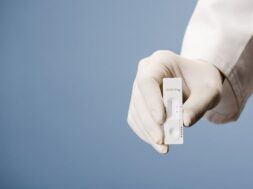 doctor-holding-test-kit-viral-disease-covid-19-sars-cov-2-lab-card-kit-test_362520-66