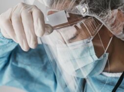 doctor-wearing-protective-equipment_23-2148847212