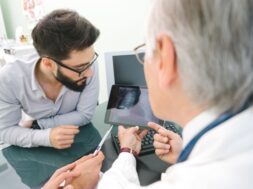 doctor_and_patient_looking_at_tablet_2_0