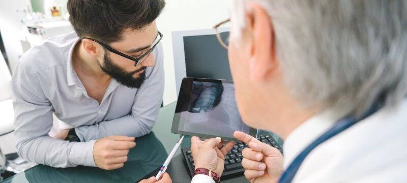 doctor_and_patient_looking_at_tablet_2_0