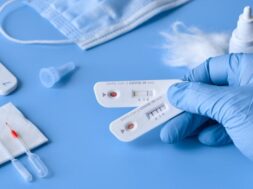 express-covid-19-test-igm-igg-antibodies-novel-corona-virus-sars-cov-2-covid-19-nurse-medtech-hand-glove-with-coronavirus-test-stripes-purple-neon-background_87646-7012