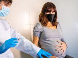 female-doctor-applying-coronavirus-vaccine-pregnant-woman-antibodies-immunize-population_242111-4665