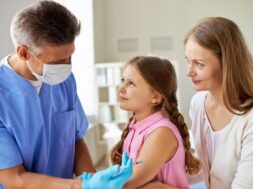 girl-receiving-vaccine-medical-office_1098-380