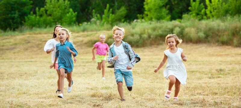 kids-children-running-meadow-summer-s-sunlight_155003-13021