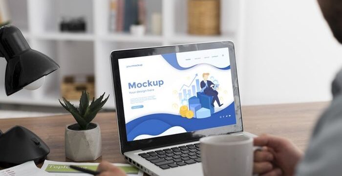 man-desk-with-laptop-mock-up_23-2148782213