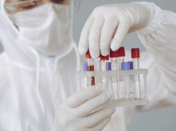 man-protective-suit-glasses-working-laboratory_1157-34434