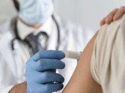 man-putting-bandage-young-woman-s-arm_23-2148755655