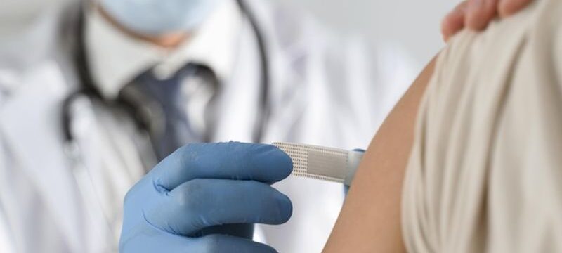 man-putting-bandage-young-woman-s-arm_23-2148755655