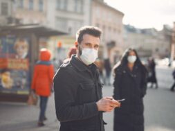 people-wearing-protective-mask-standing-street_1157-32367