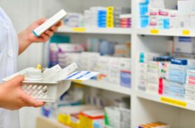 pharmacist-filling-prescription-pharmacy-drugstore_67340-187