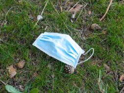 surgical-mask-lying-ground-grass_301038-869