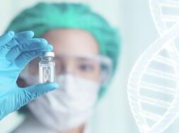woman-doctor-holding-transparent-glass-bottle-with-dna-icon-inside-her-hand_46370-2407