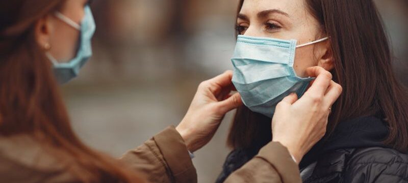 young-people-are-spreading-disposable-masks-outside_1157-31369