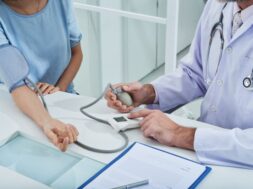 anonymous-doctor-measuring-blood-pressure-unrecognizable-patient-with-tonometer_1098-19336