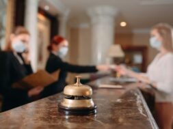 check-hotel-receptionist-counter-hotel-wearing-medical-masks-as-precaution-against-virus-young-woman-business-trip-doing-check-hotel_109285-8411