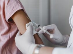 doctor-administering-vaccine-child_23-2148801351