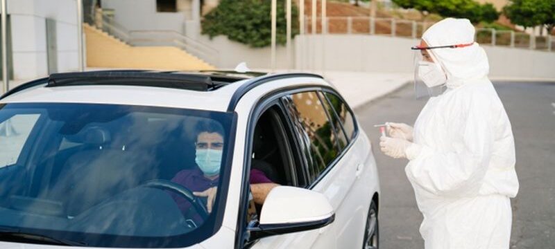 doctor-doing-pcr-test-covid-19-patient-through-car-window_147764-735