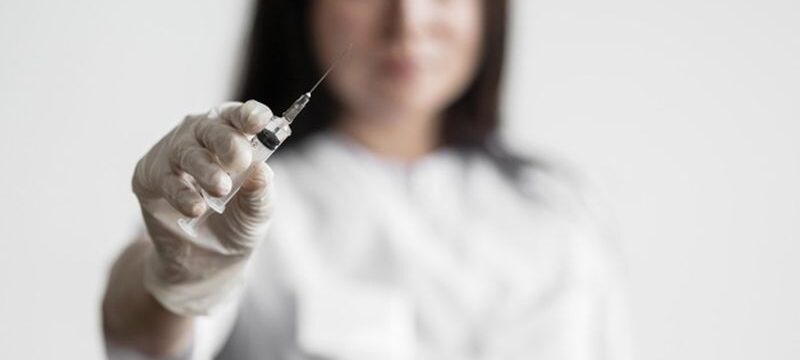 doctor-preparing-medical-vaccine_23-2148733979