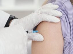 doctor-vaccinating-patient-clinic_23-2148920134