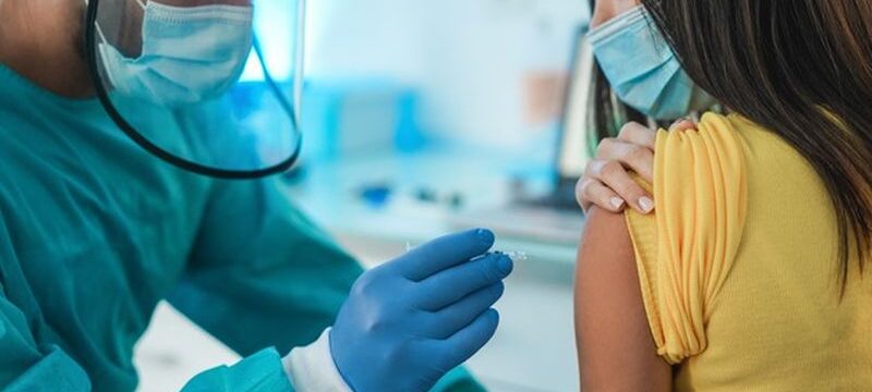 doctor-with-hazmat-suit-protective-gloves-giving-patient-vaccine-coronavirus-disease-focus-doctor-hand_166273-1005