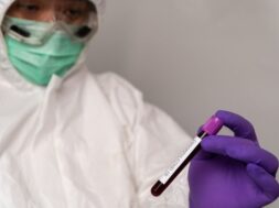 doctors-protective-suits-masks-are-holding-positive-blood-test-result-new-rapidly-outbreaking-coronavirus_41689-1169