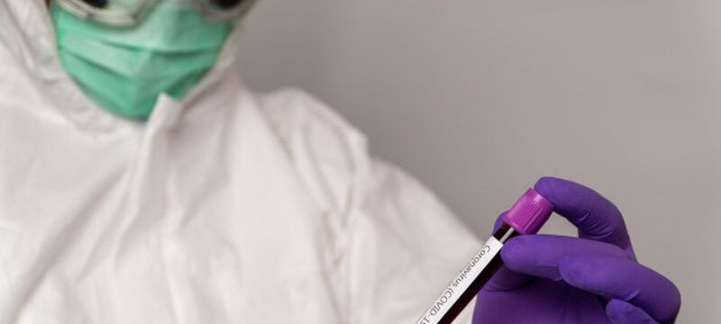 doctors-protective-suits-masks-are-holding-positive-blood-test-result-new-rapidly-outbreaking-coronavirus_41689-1169